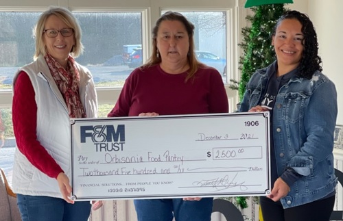 bank reps present donation check to food pantry rep